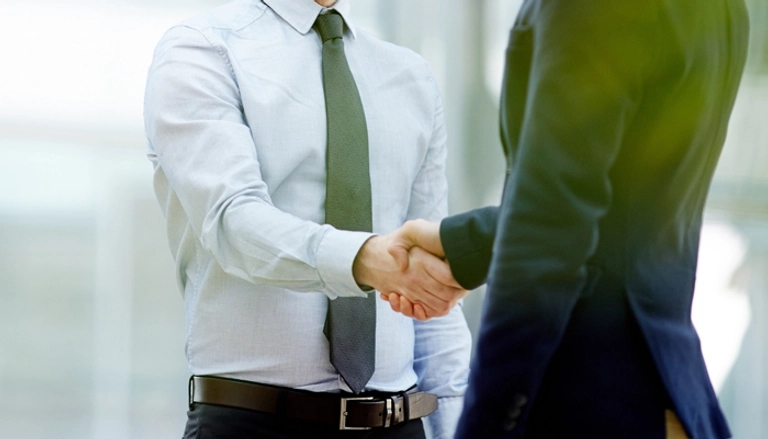 2 men shaking hands