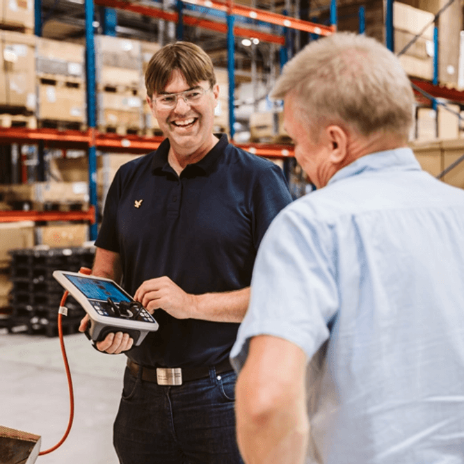 Nolato Polymer employees talking to each other.